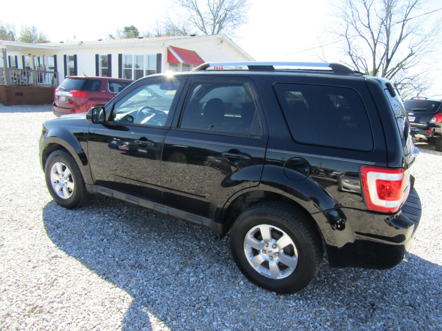 2010 Black Ford Escape Limited FWD (1FMCU0EG8AK) with an 3.0L V6 DOHC 24V engine, Automatic transmission, located at 15016 S Hwy 231, Midland City, AL, 36350, (334) 983-3001, 31.306210, -85.495277 - Photo#5